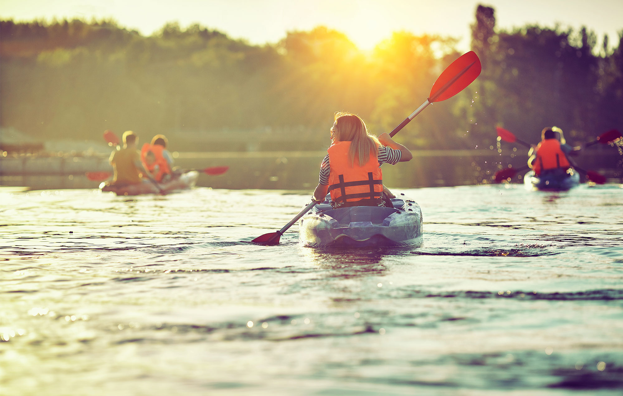 Several kayakers on a lake