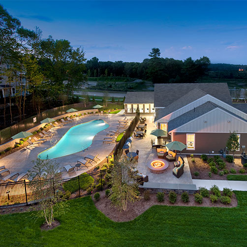 Aerial view of apartment pool area with clubhouse
